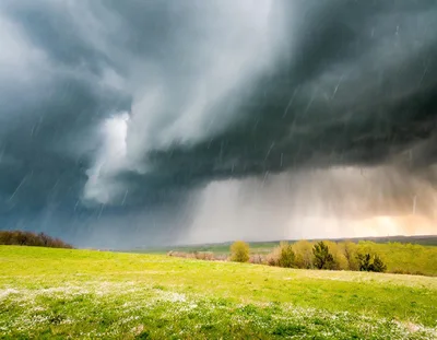 Dramatic Storm Clouds Over A Green Meadow