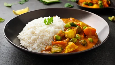 Vegetable Curry With Steamed White Rice In Bowl