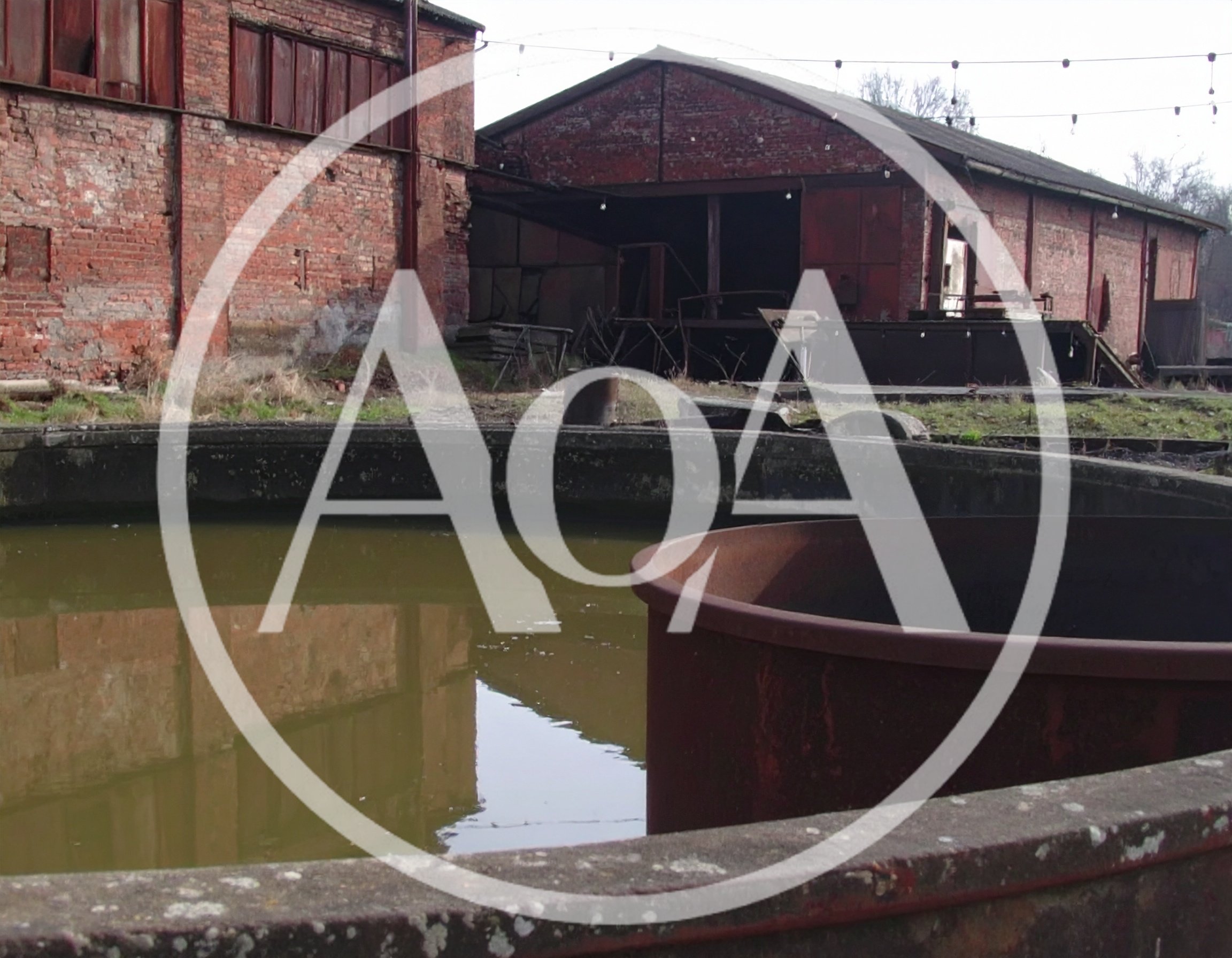 Abandoned Industrial Site With Circular Water Tank