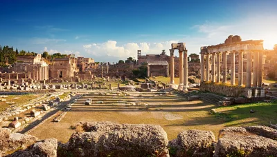 Ancient Roman Forum Ruins Under Bright Blue Sky