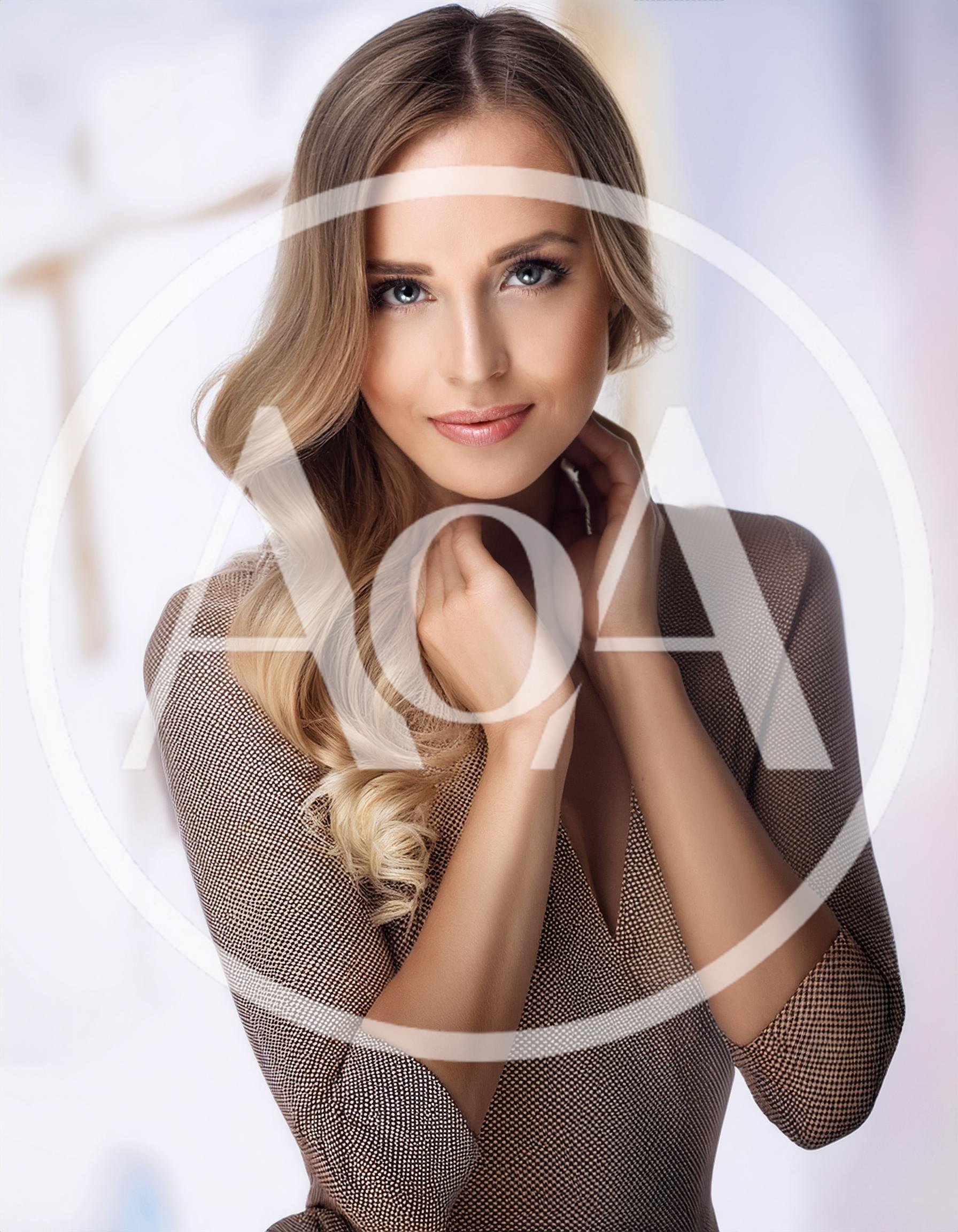 Portrait Of A Beautiful Blonde Woman In A Dress