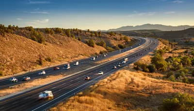 Aerial View Of Traffic On A Desert Highway