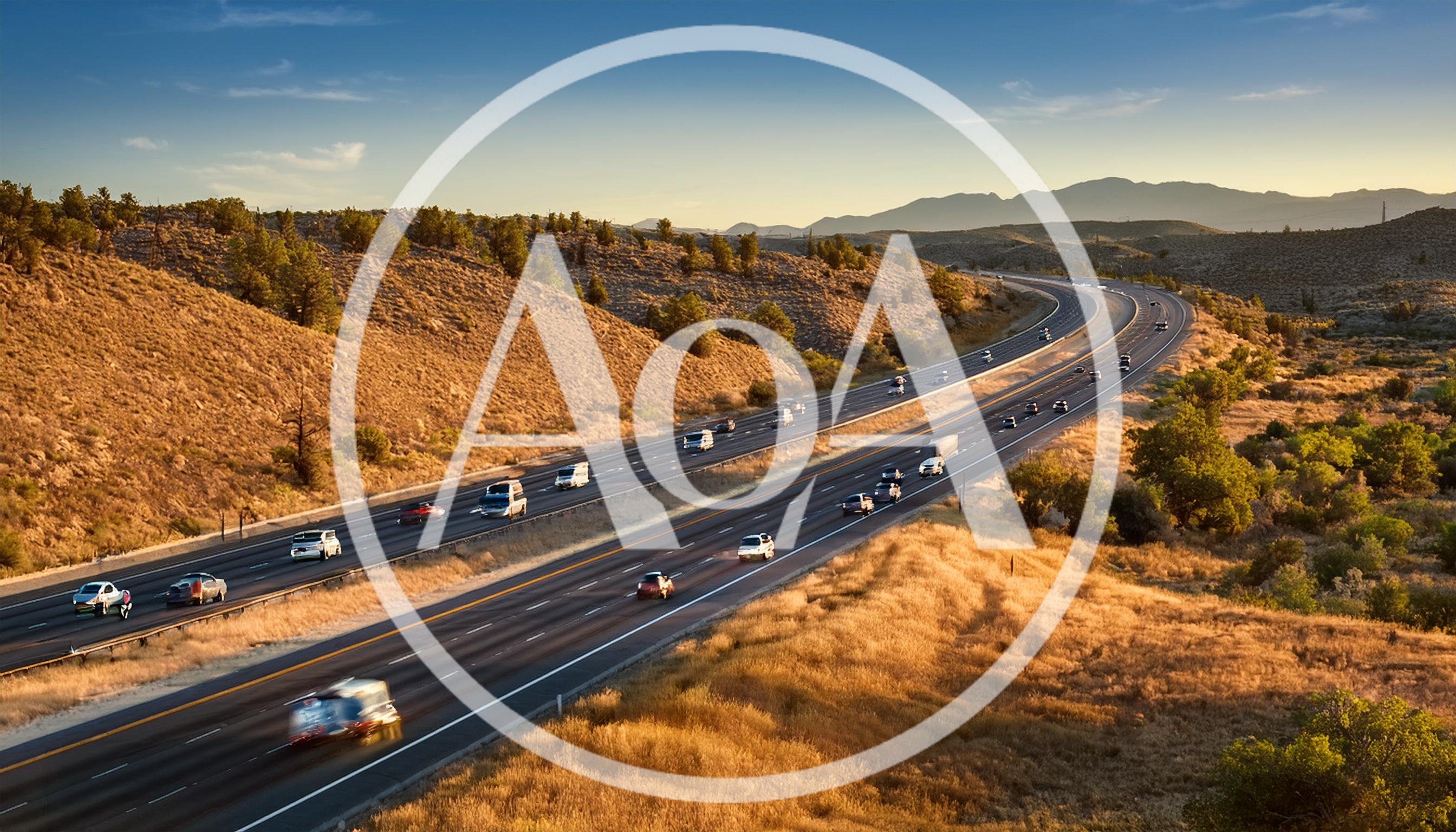 Aerial View Of Traffic On A Desert Highway