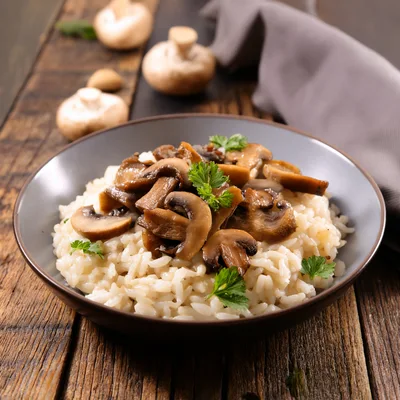 Creamy Mushroom Risotto Served In A Bowl