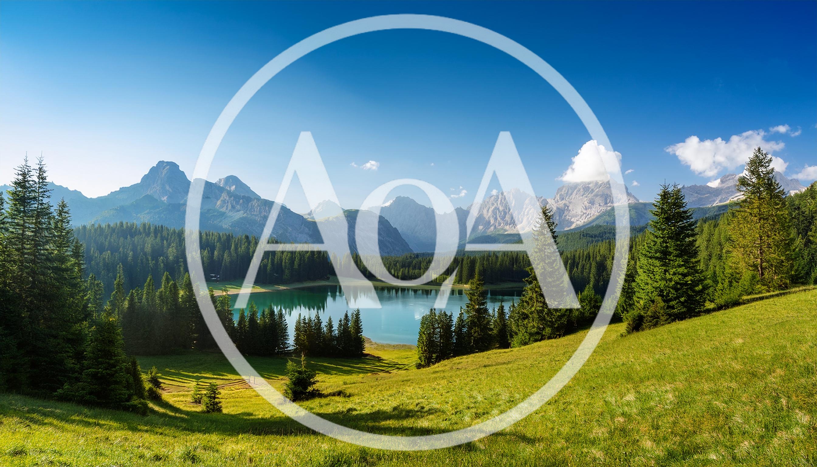 Scenic Alpine Lake Surrounded By Pine Forest And Mountains