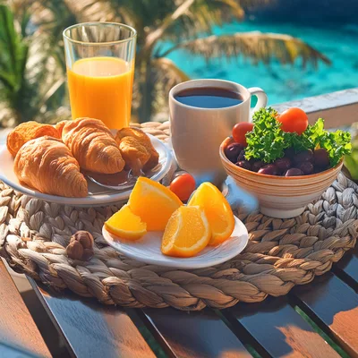 Breakfast Table With Croissants And Fresh Fruit