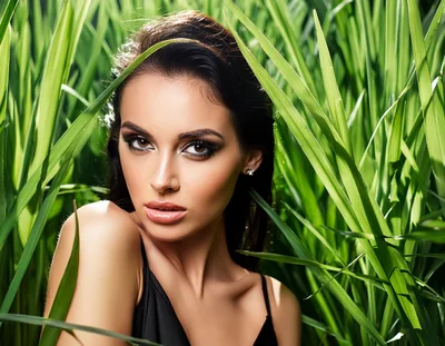 Portrait of a Beautiful Woman in Tall Green Grass