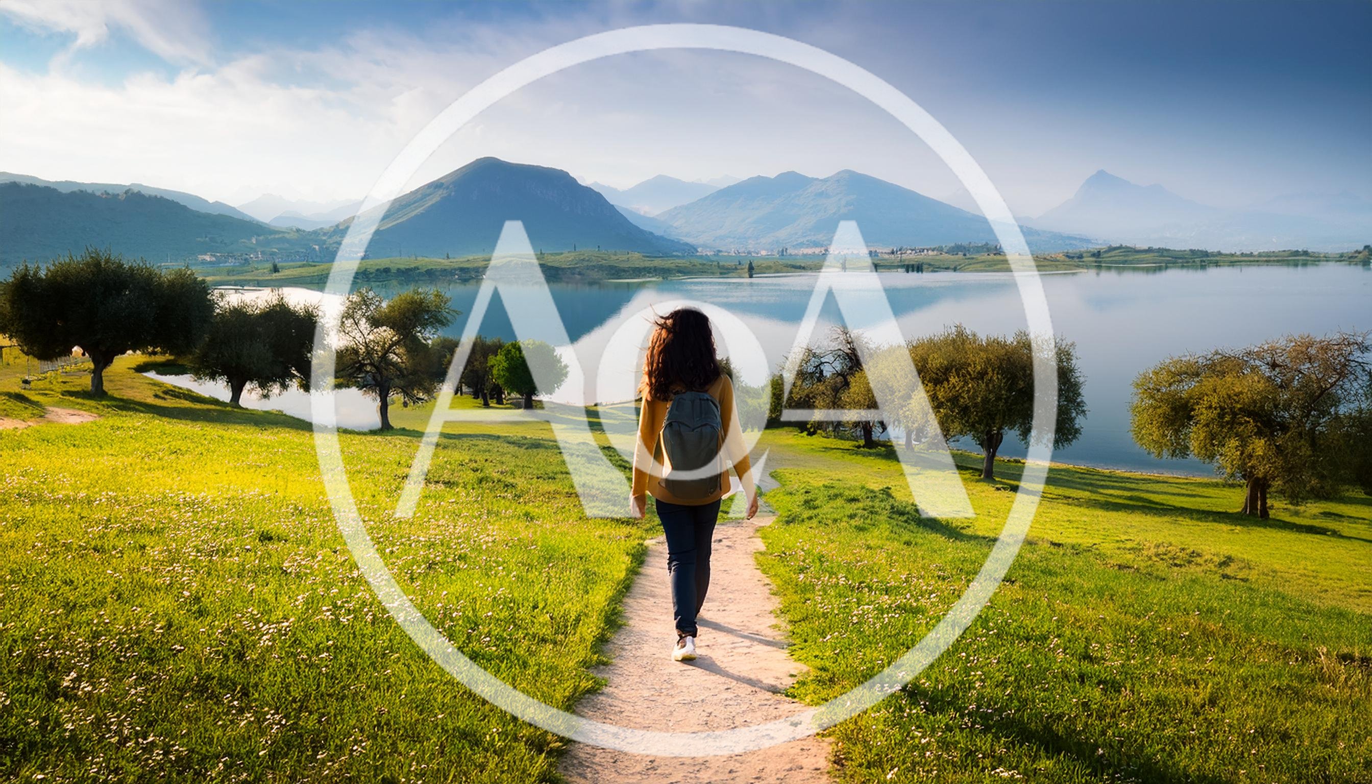 Woman Hiking On A Scenic Trail By A Lake