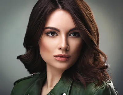 Portrait Of A Beautiful Woman In A Green Jacket