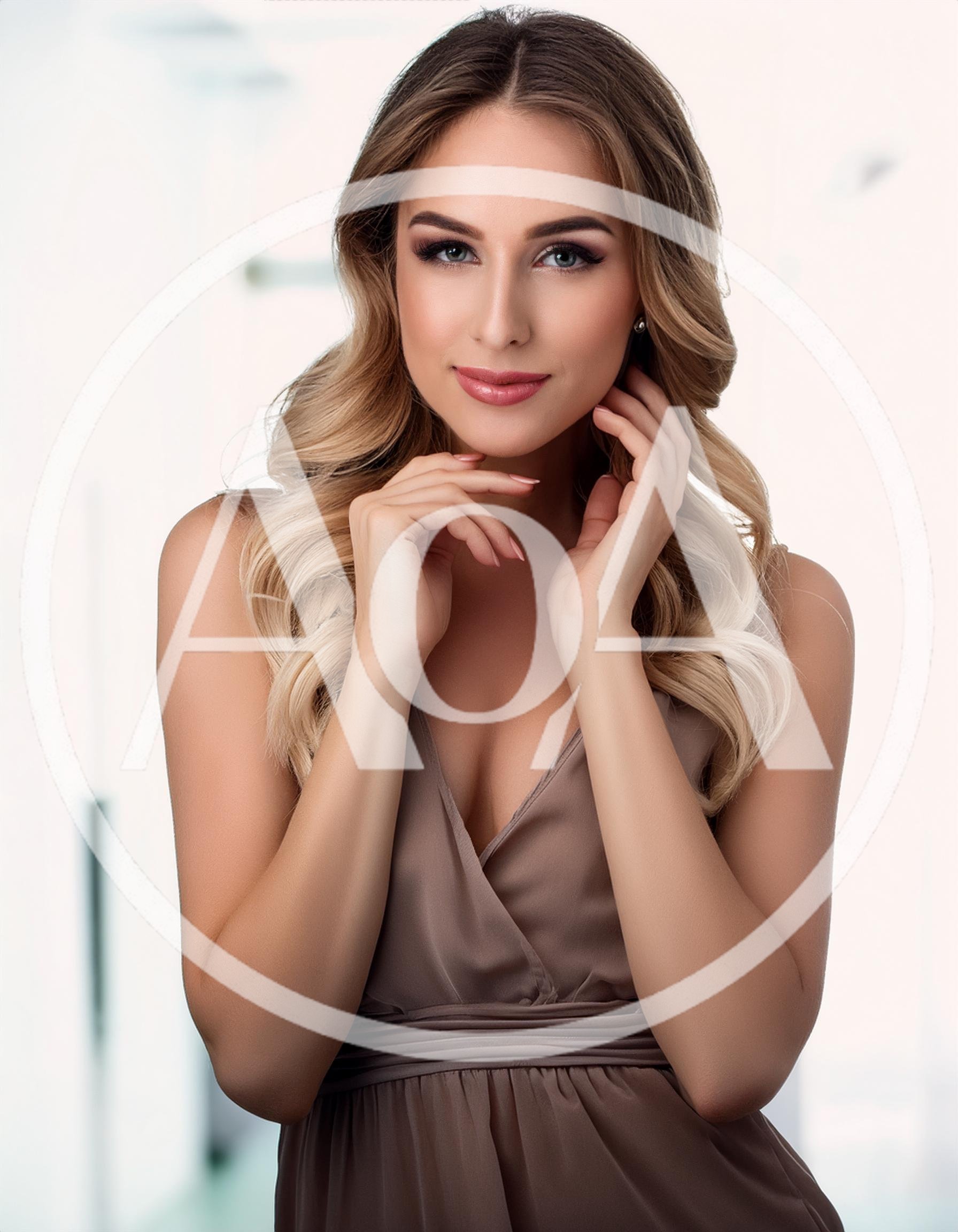 Portrait Of A Beautiful Blonde Woman In A Dress
