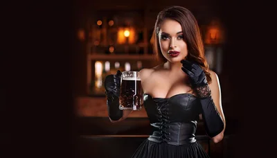 Elegant Woman Holding A Beer Mug In A Bar