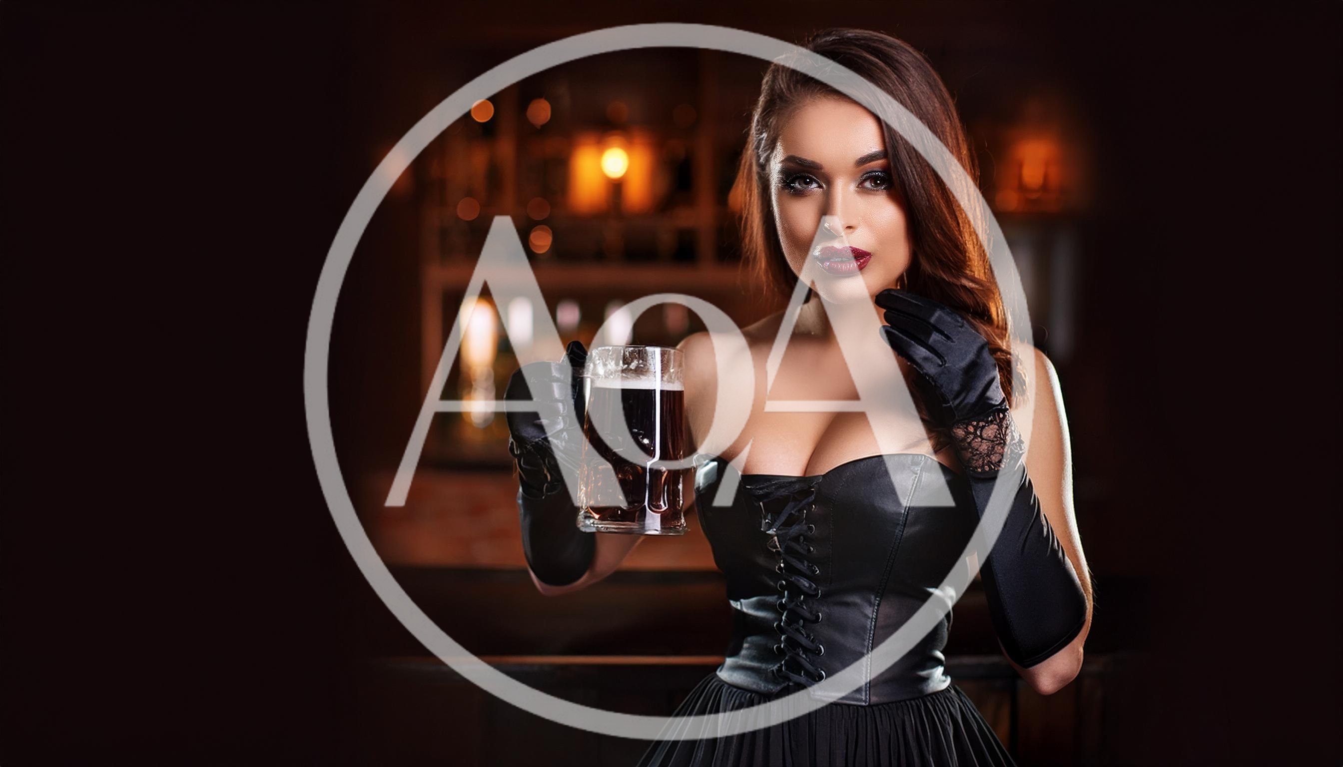 Elegant Woman Holding A Beer Mug In A Bar