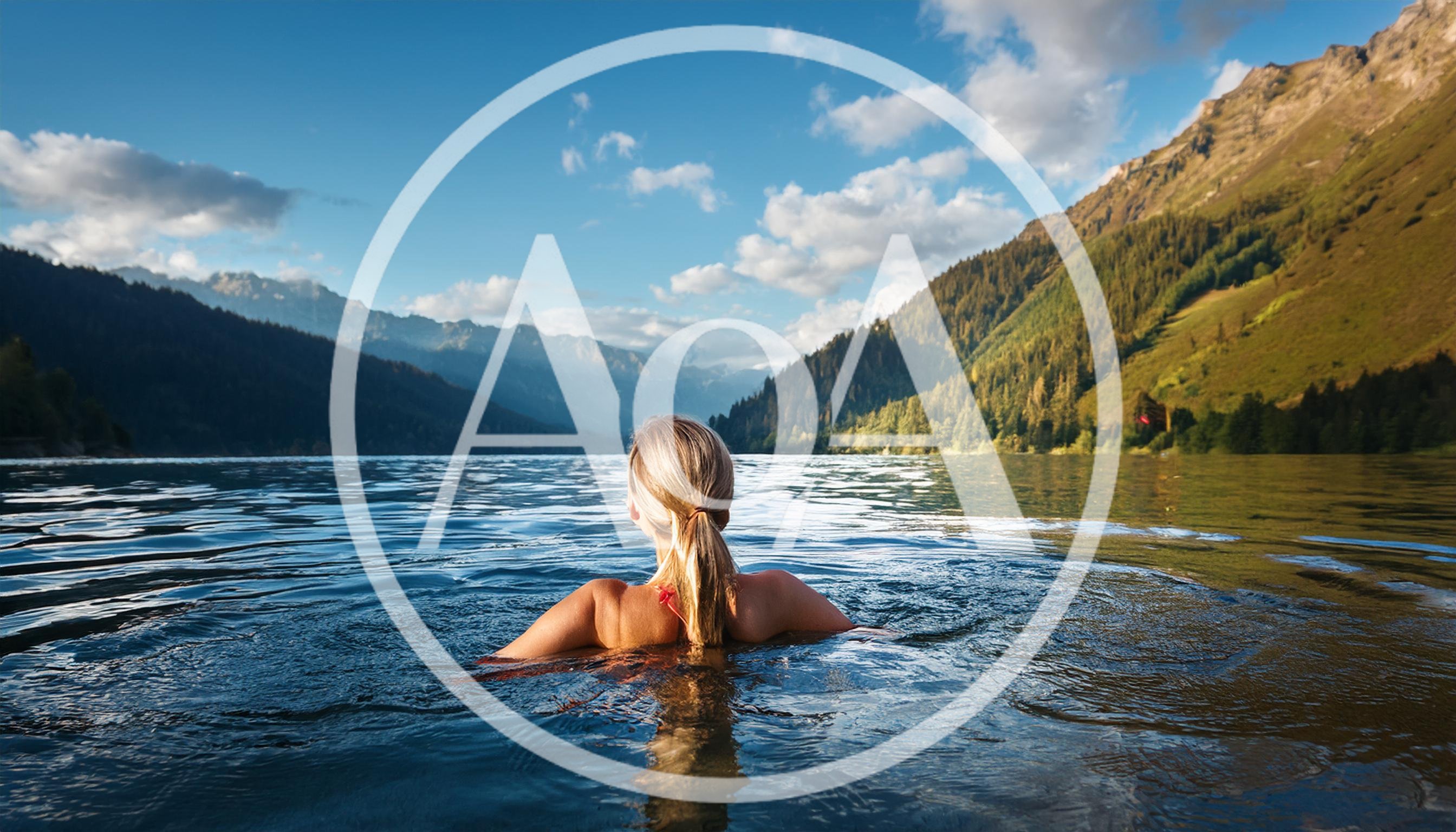 Woman Swimming In A Mountain Lake