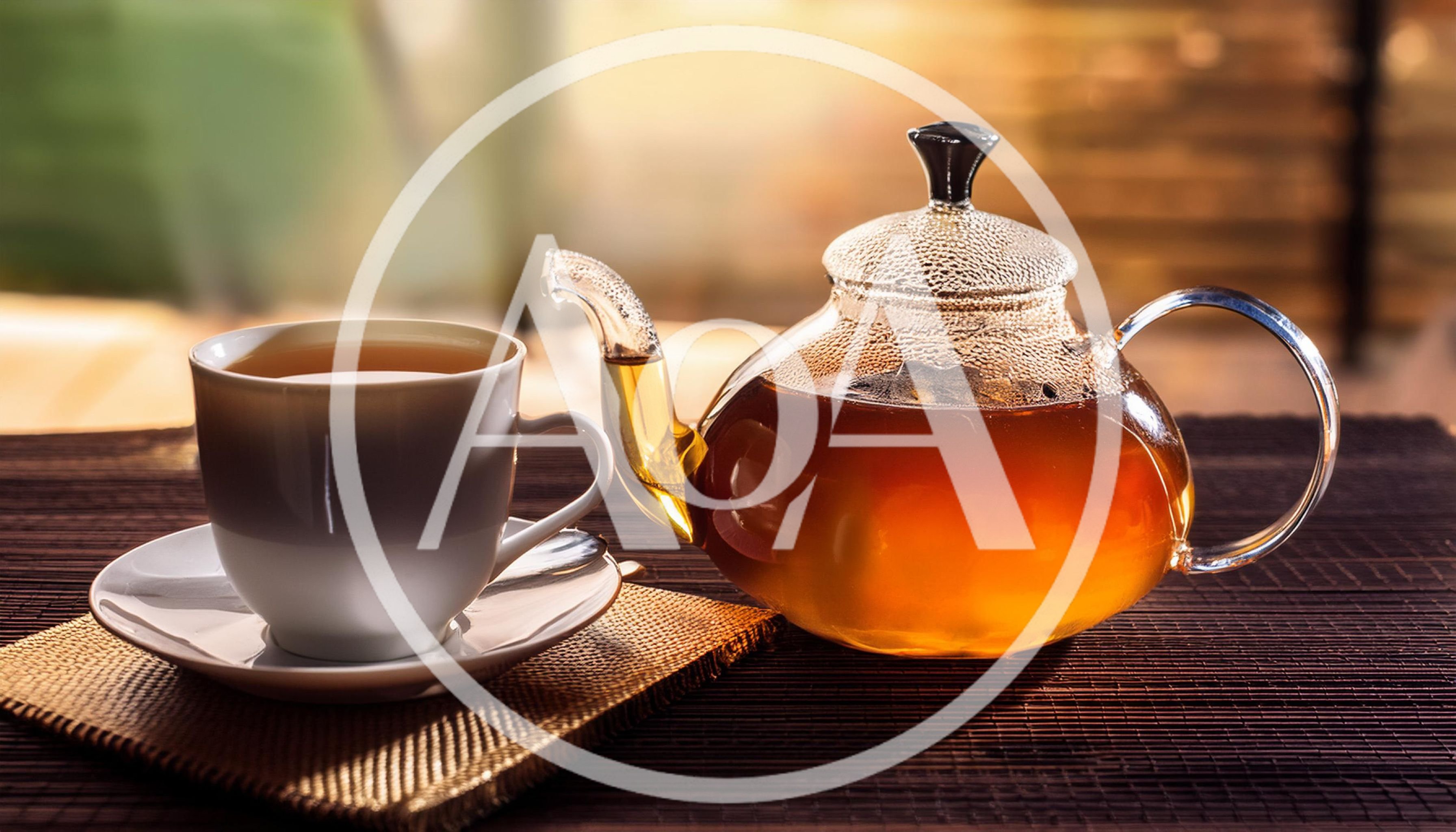 Glass Teapot And White Cup Of Tea