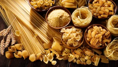 Assorted Dry Pasta Varieties With Wheat Stalks
