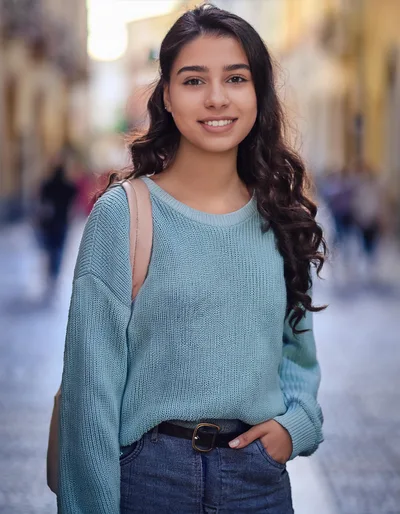 Young Woman Smiling Outdoors In A City Street