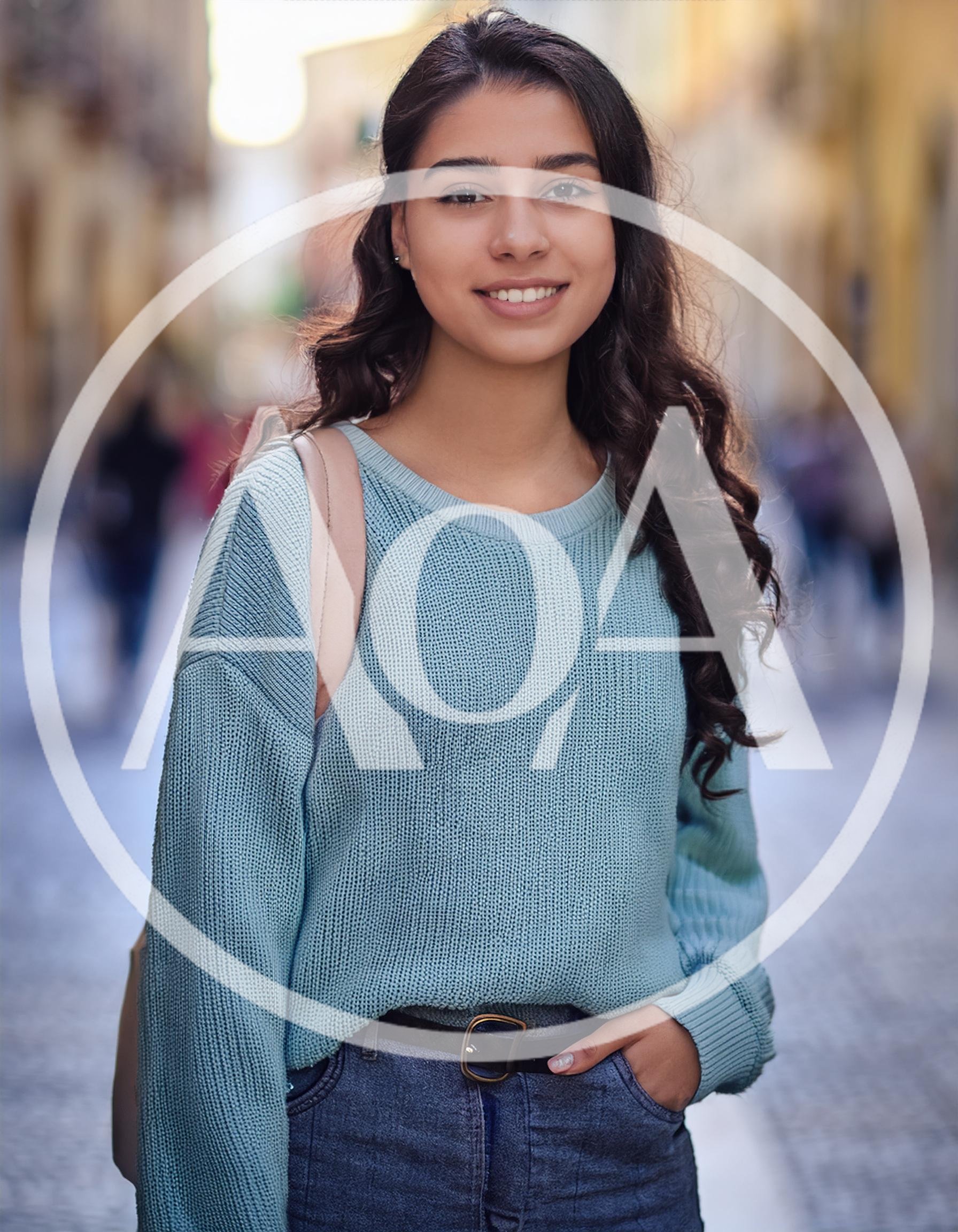 Young Woman Smiling Outdoors In A City Street