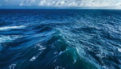 Aerial View Of Choppy Deep Blue Ocean Waves