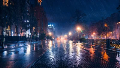 Rainy Night Street Scene With Wet Cobblestone Road