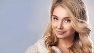 Portrait Of A Beautiful Blonde Woman In A Sweater