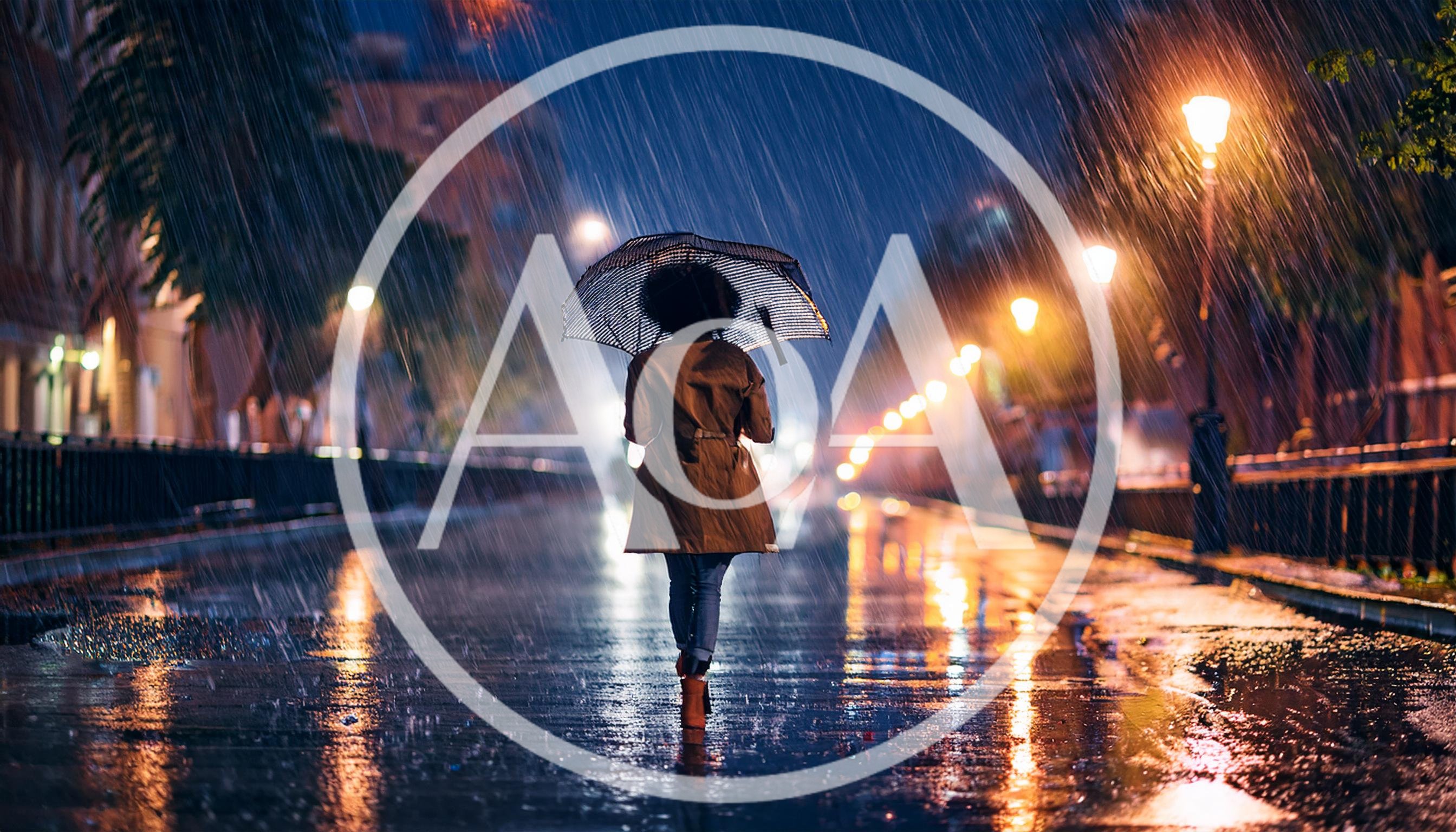 Woman Walking With Umbrella In Heavy Rain At Night
