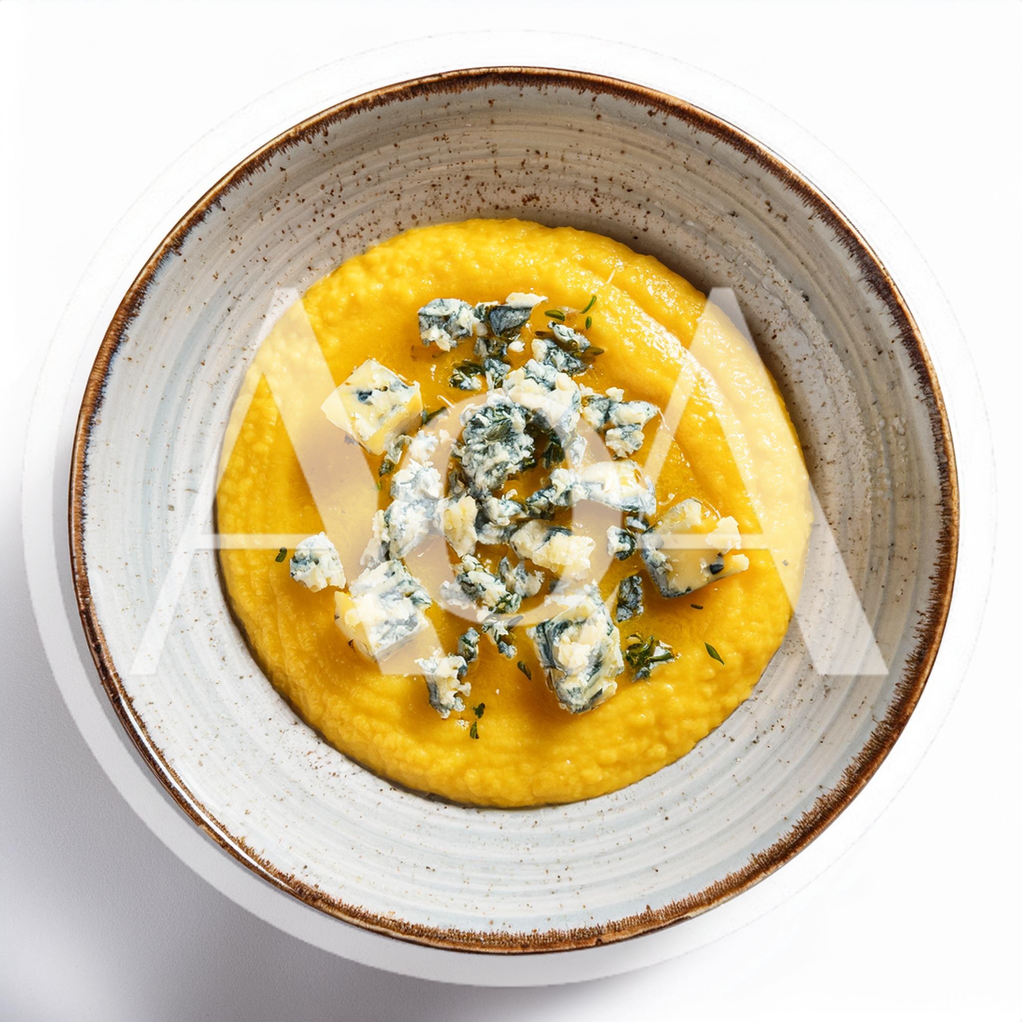 Bowl Of Creamy Pumpkin Soup With Blue Cheese