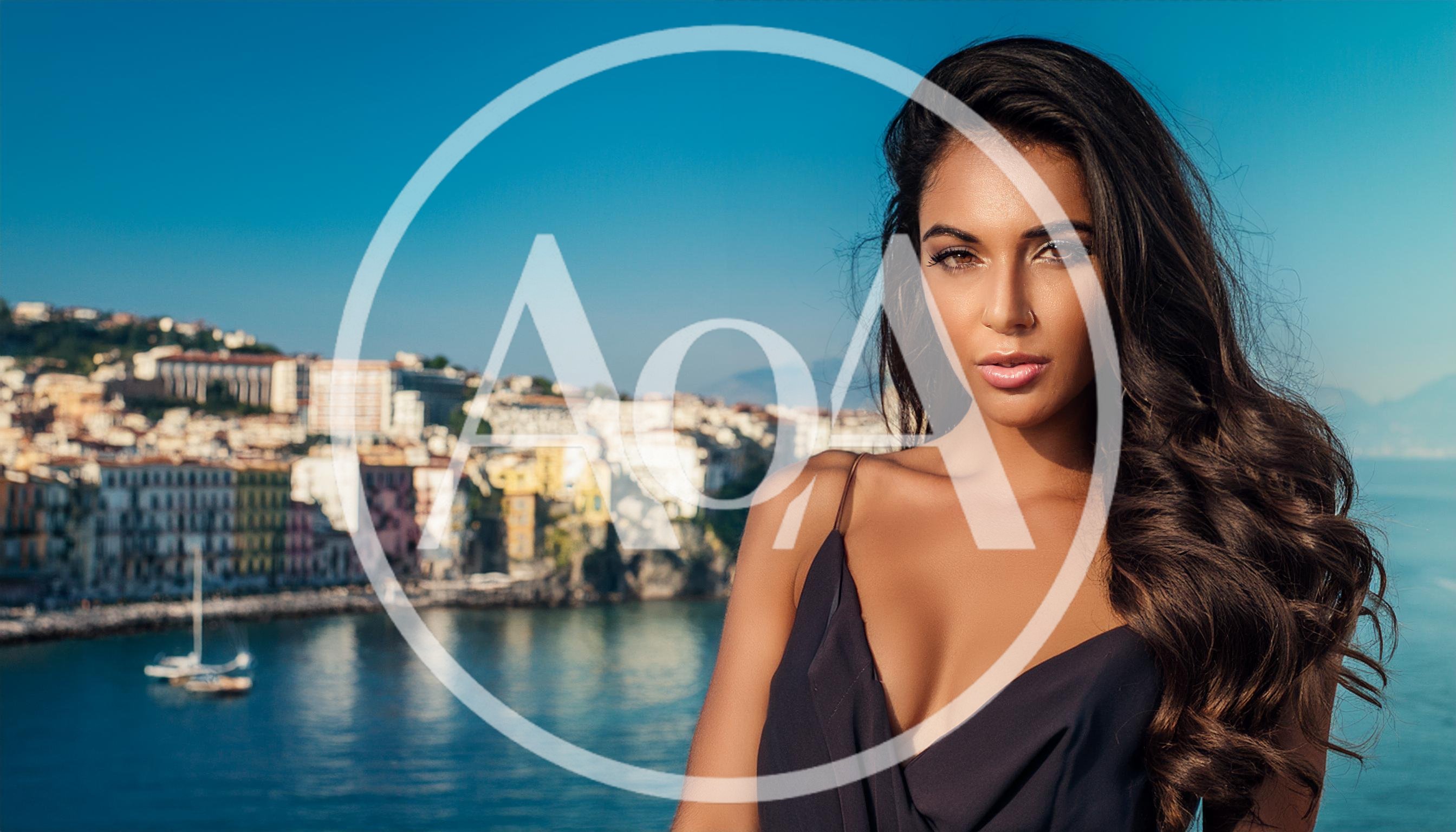 Beautiful Woman Posing Against A Coastal Italian Cityscape