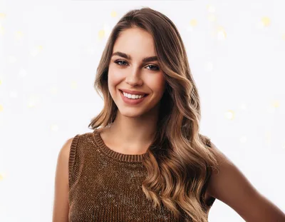Portrait Of A Smiling Young Woman With Wavy Hair