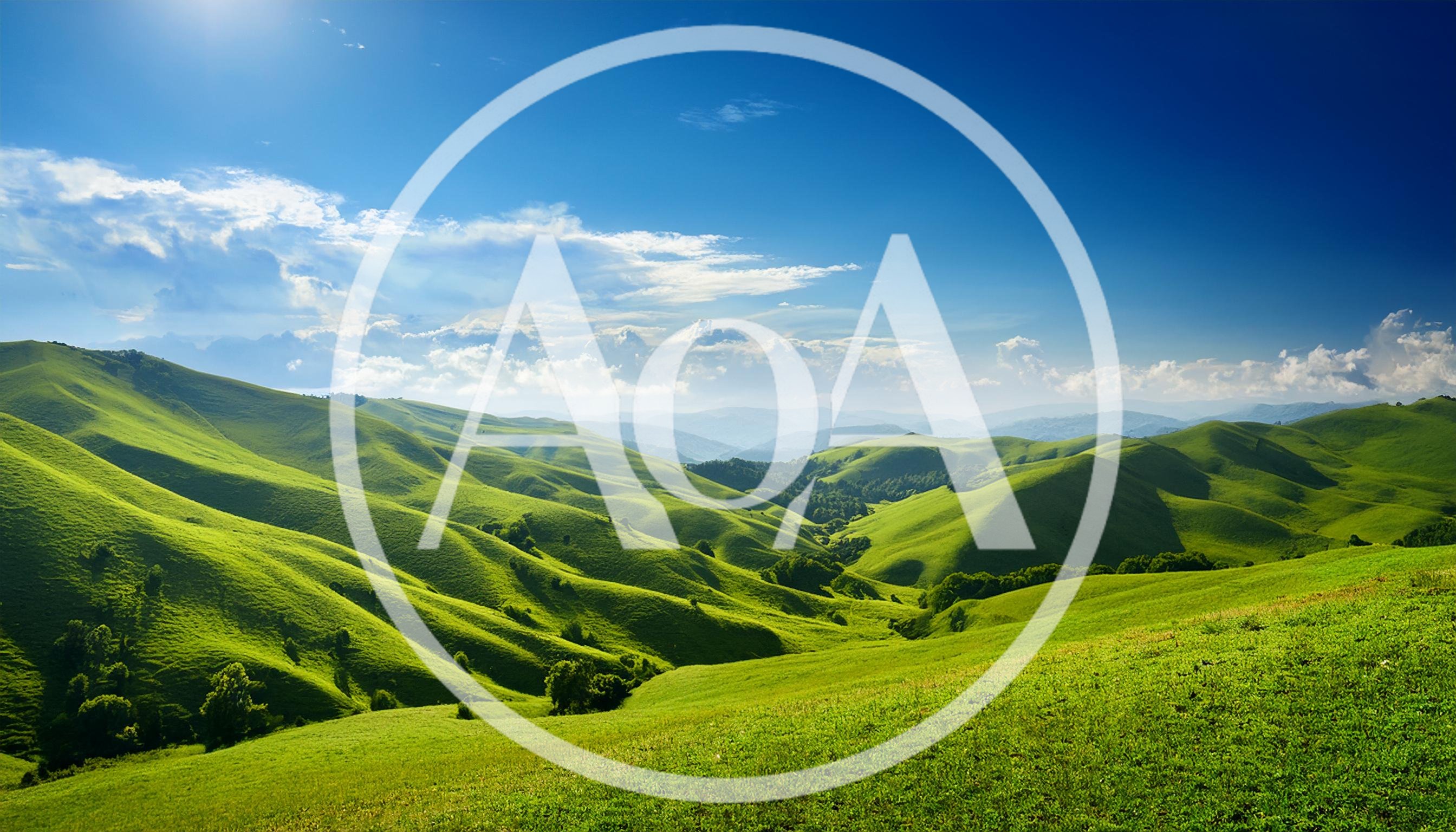 Rolling Green Hills Under A Bright Blue Sky