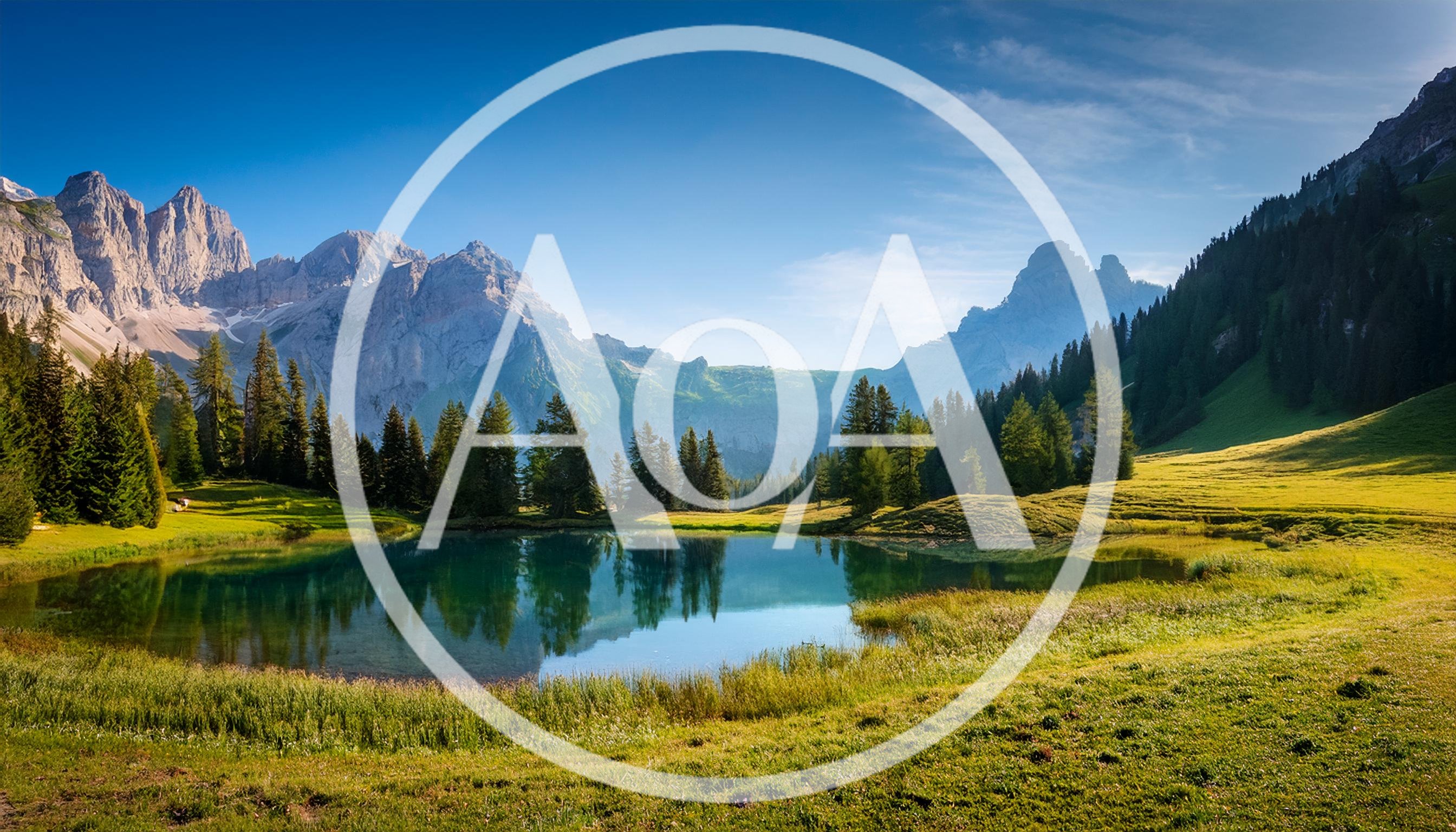 Alpine Lake Surrounded By Pine Trees And Mountains