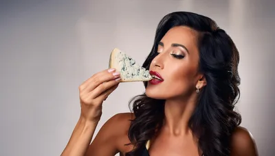 Elegant Woman Holding A Slice Of Blue Cheese