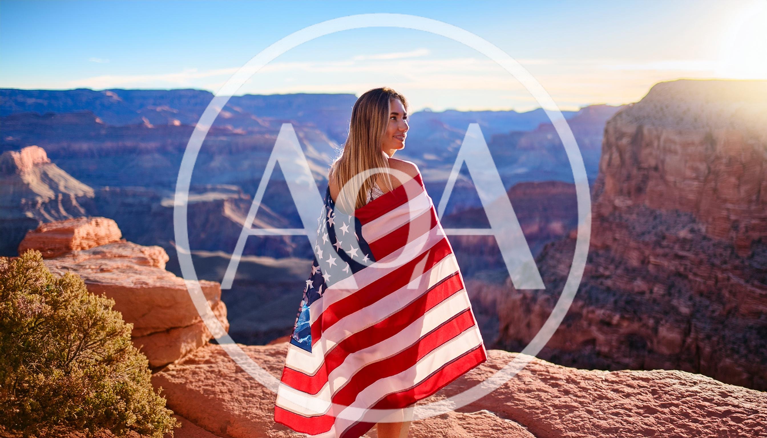 Woman Wrapped In American Flag At Grand Canyon