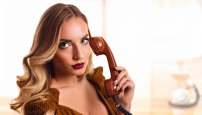 Beautiful Woman Holding Vintage Telephone Receiver