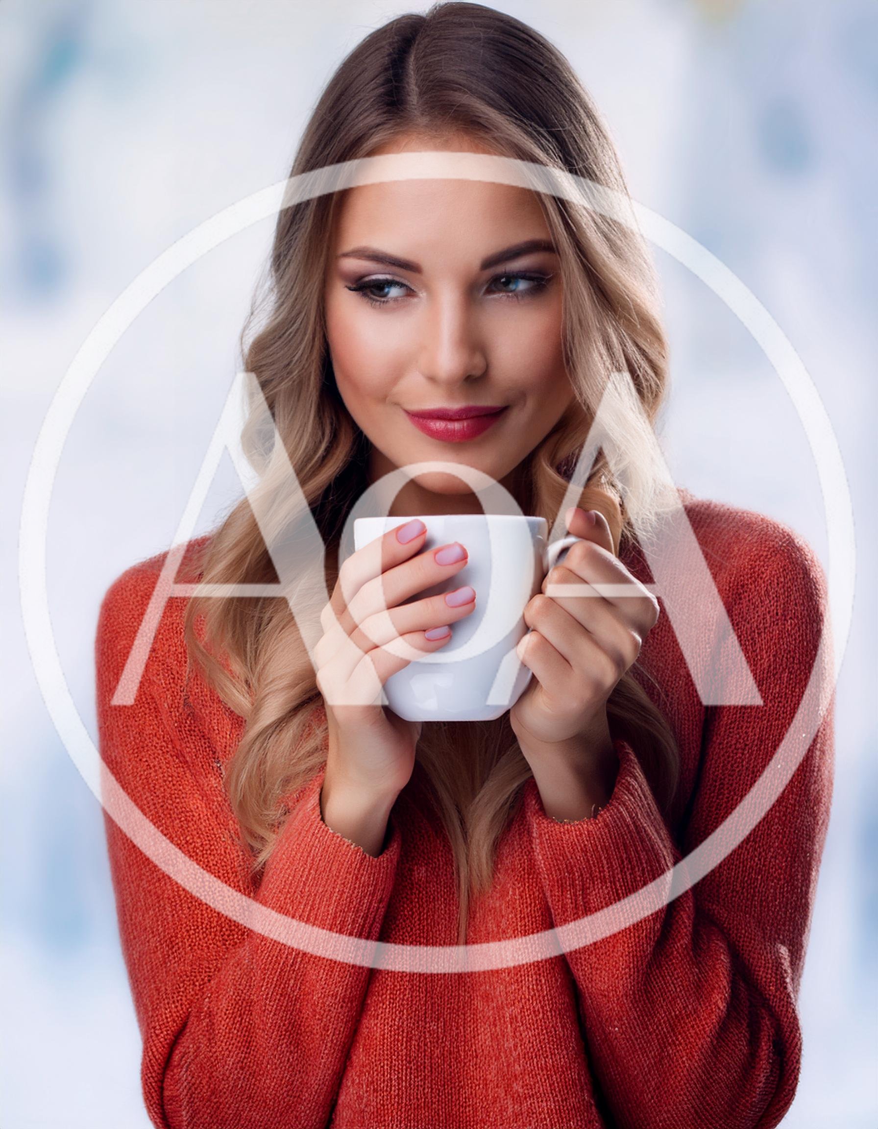 Young Woman Holding A White Coffee Mug