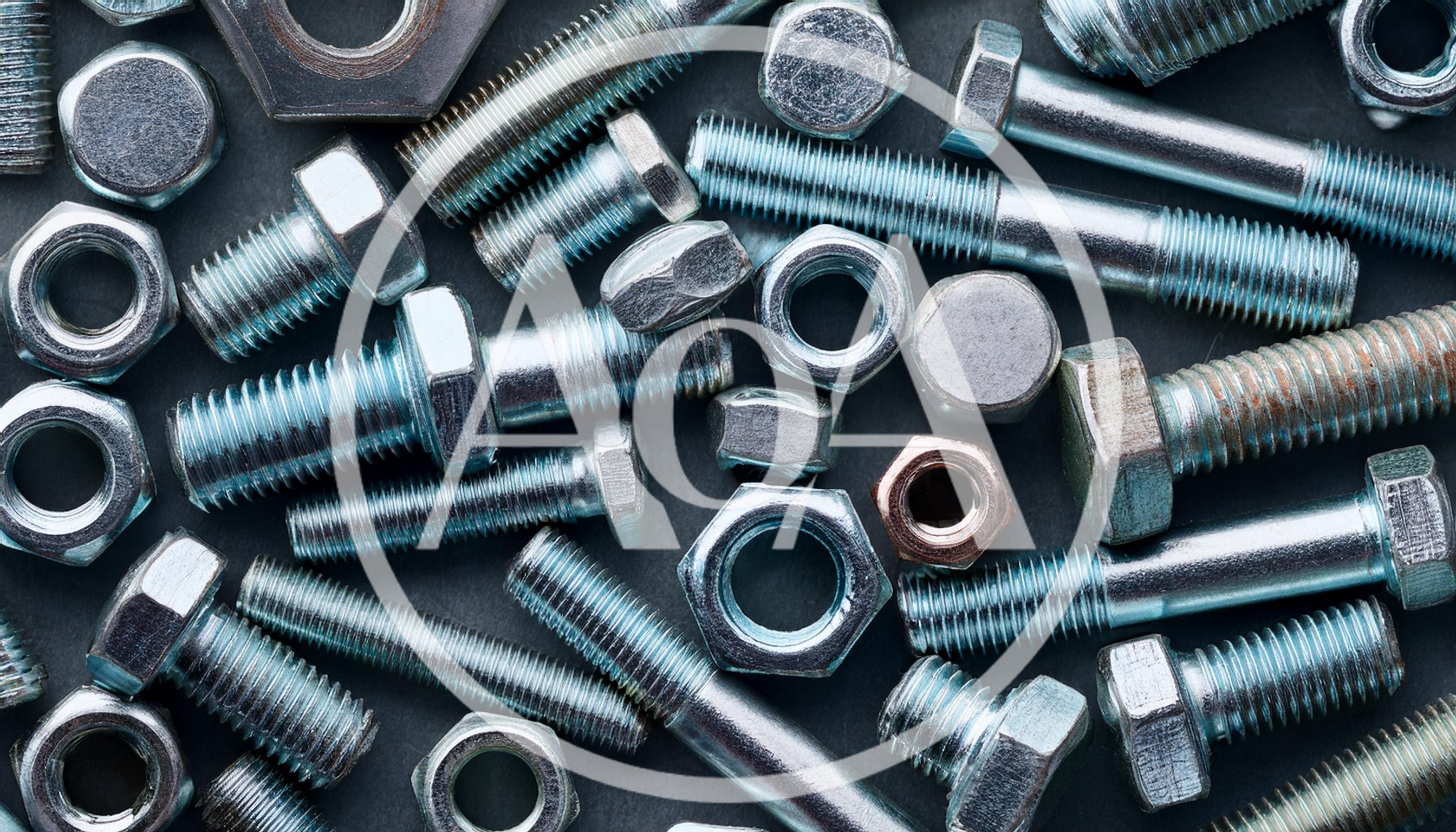 Assorted Metal Bolts and Nuts on Dark Background