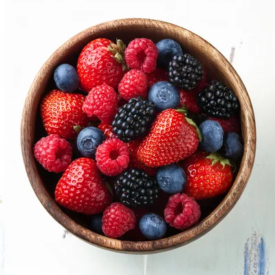 Fresh Mixed Berries In A Wooden Bowl