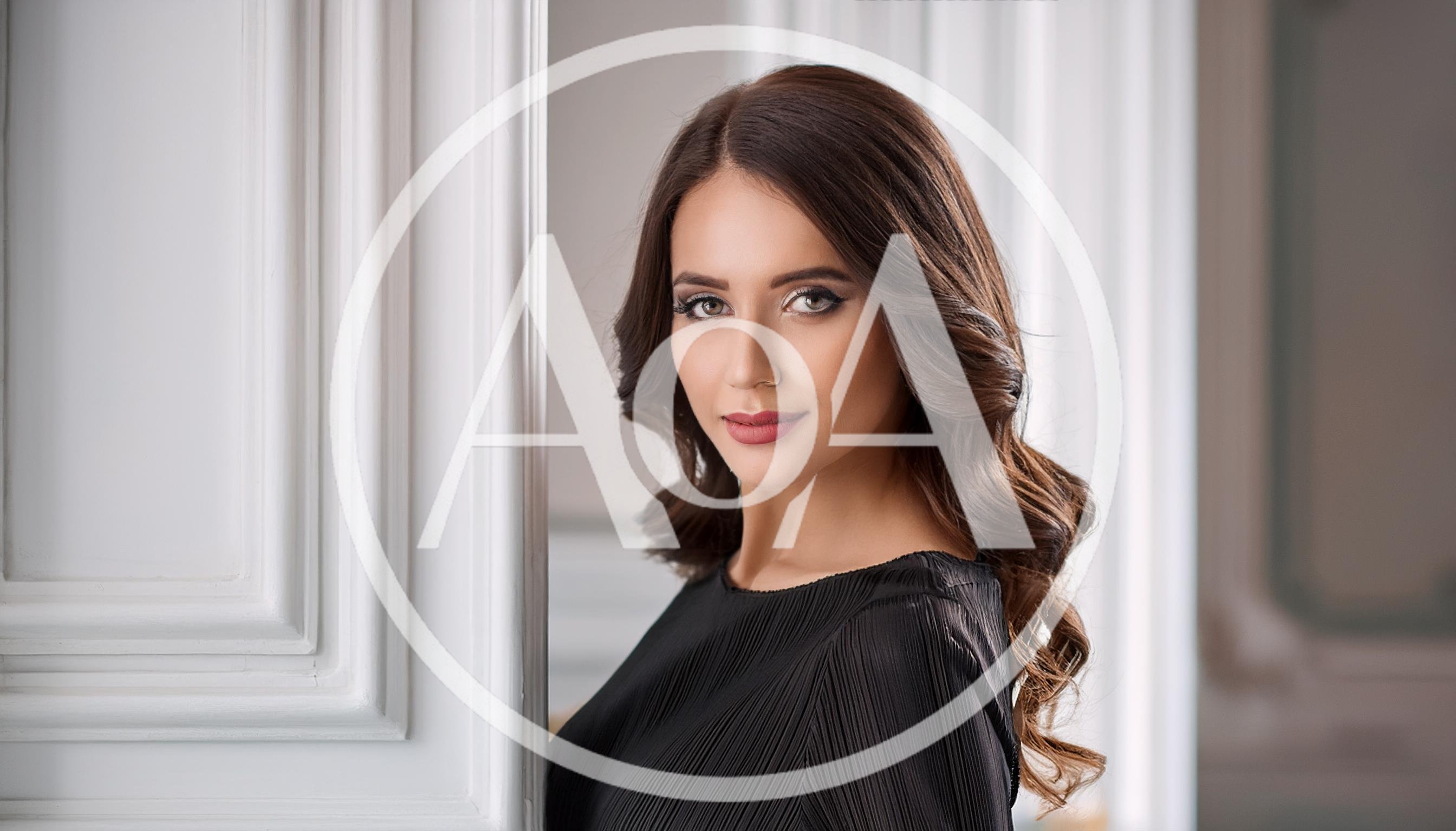 Portrait Of A Beautiful Woman In A Black Dress