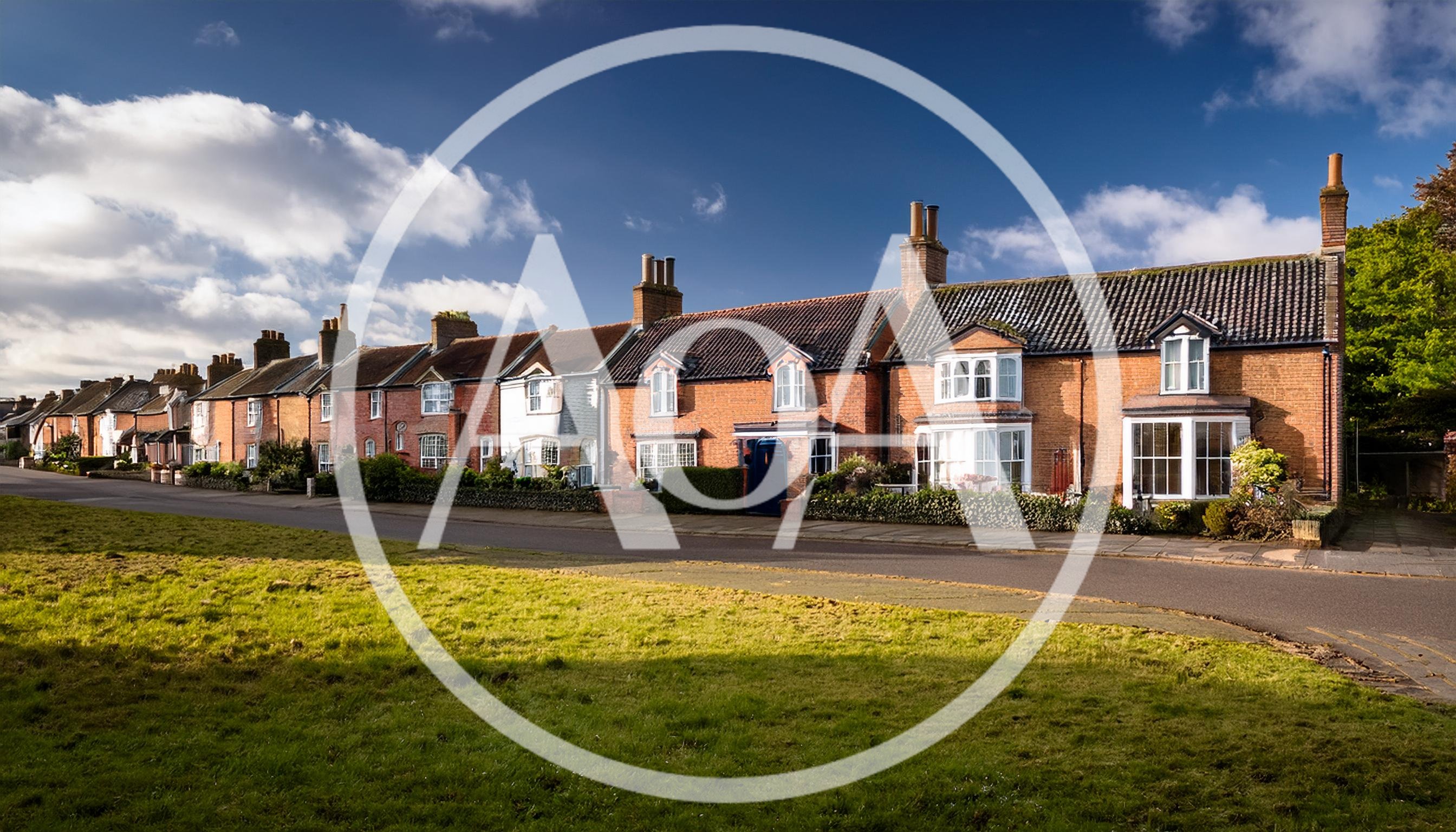 Row Of Traditional English Brick Cottages In Village