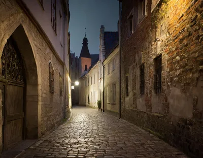 Narrow Cobblestone Street In Old Town Tallinn At Night