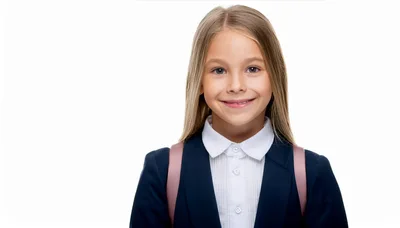 Portrait Of A Smiling Schoolgirl With A Backpack