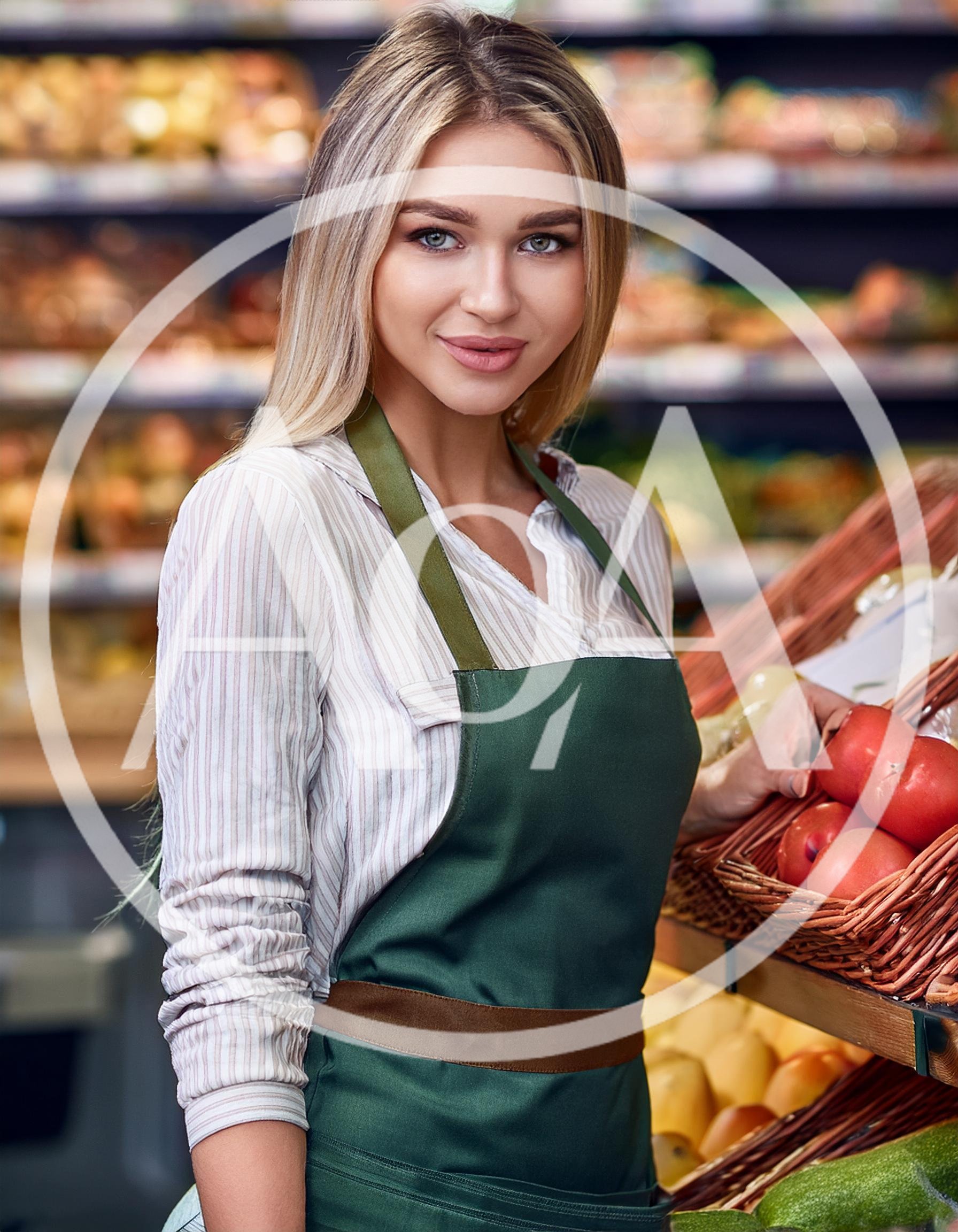 Female Grocery Store Clerk Arranging Fresh Tomatoes