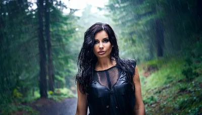Woman With Wet Hair Standing In Rain In Forest