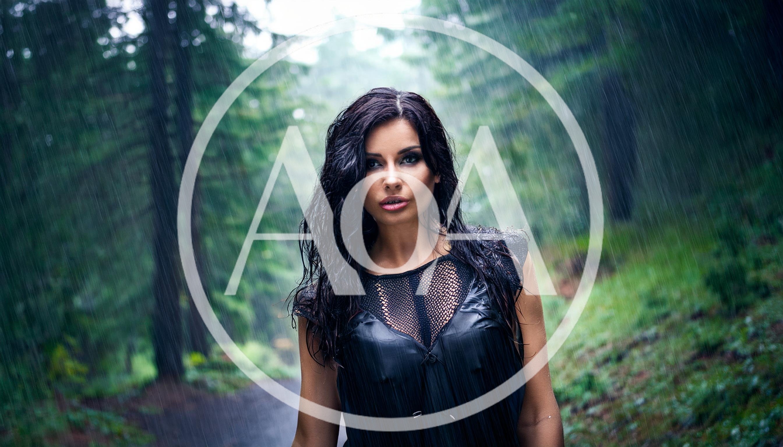 Woman With Wet Hair Standing In Rain In Forest