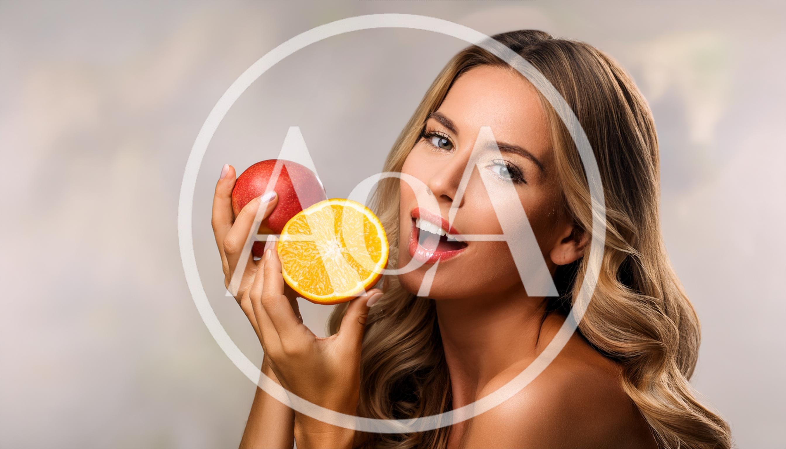 Beautiful Woman Holding Fresh Apple And Orange Slice