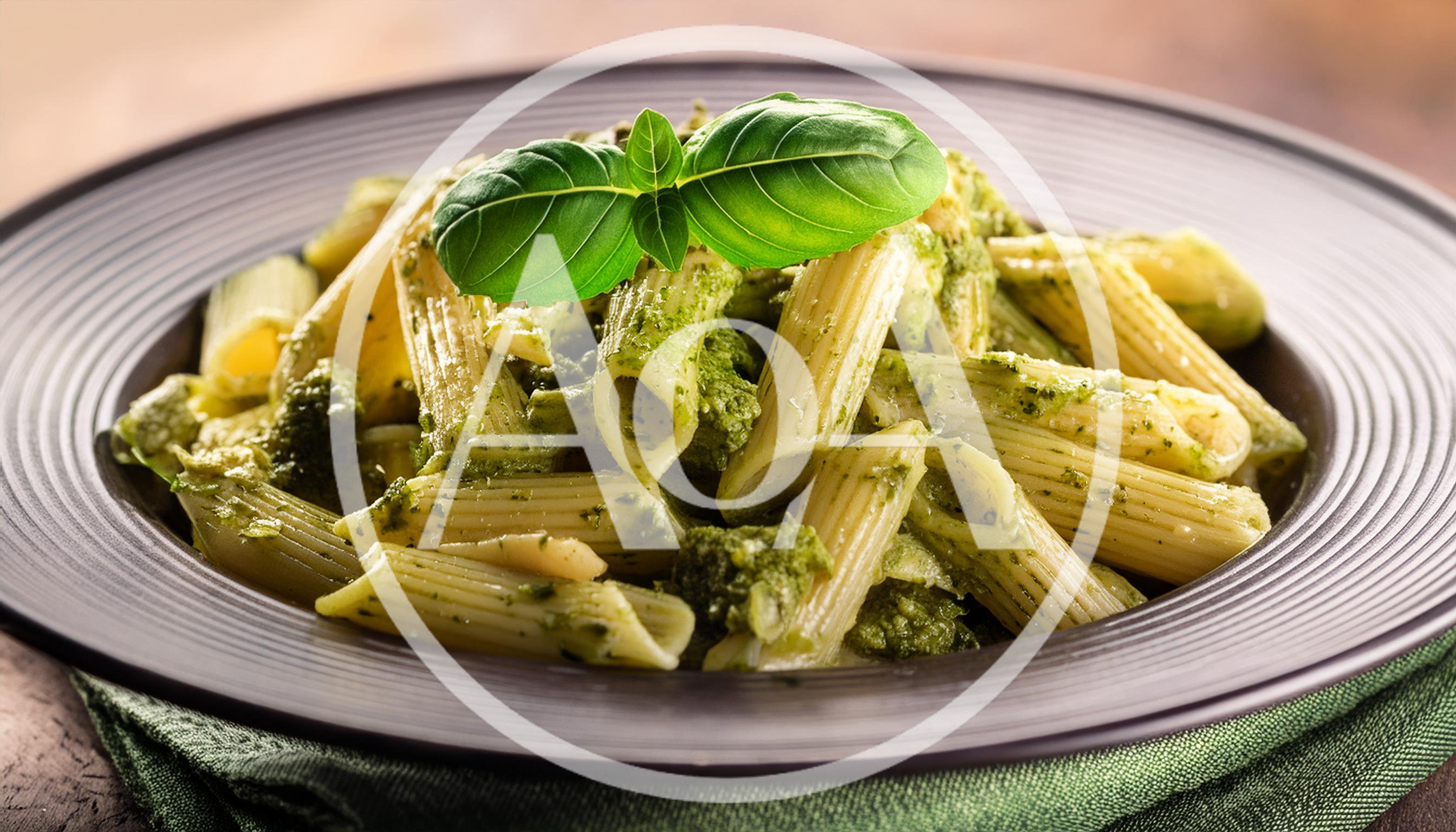 Penne Pasta With Pesto Sauce In A Bowl