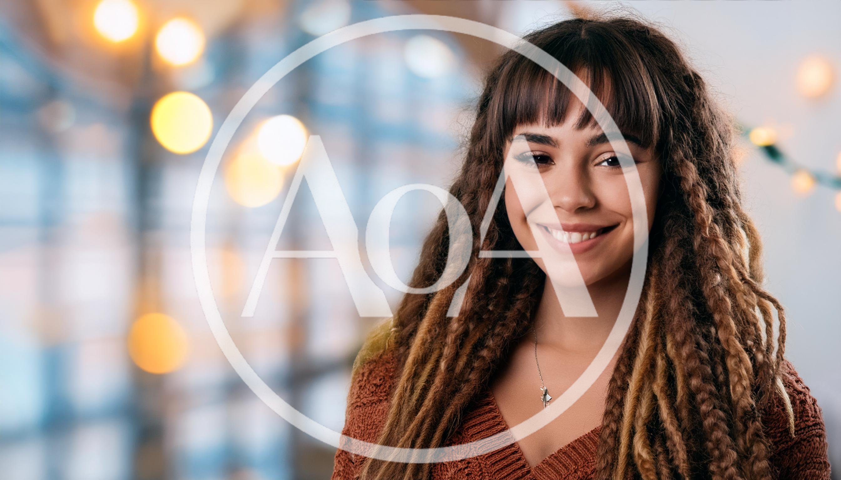 Portrait Of A Smiling Young Woman With Dreadlocks
