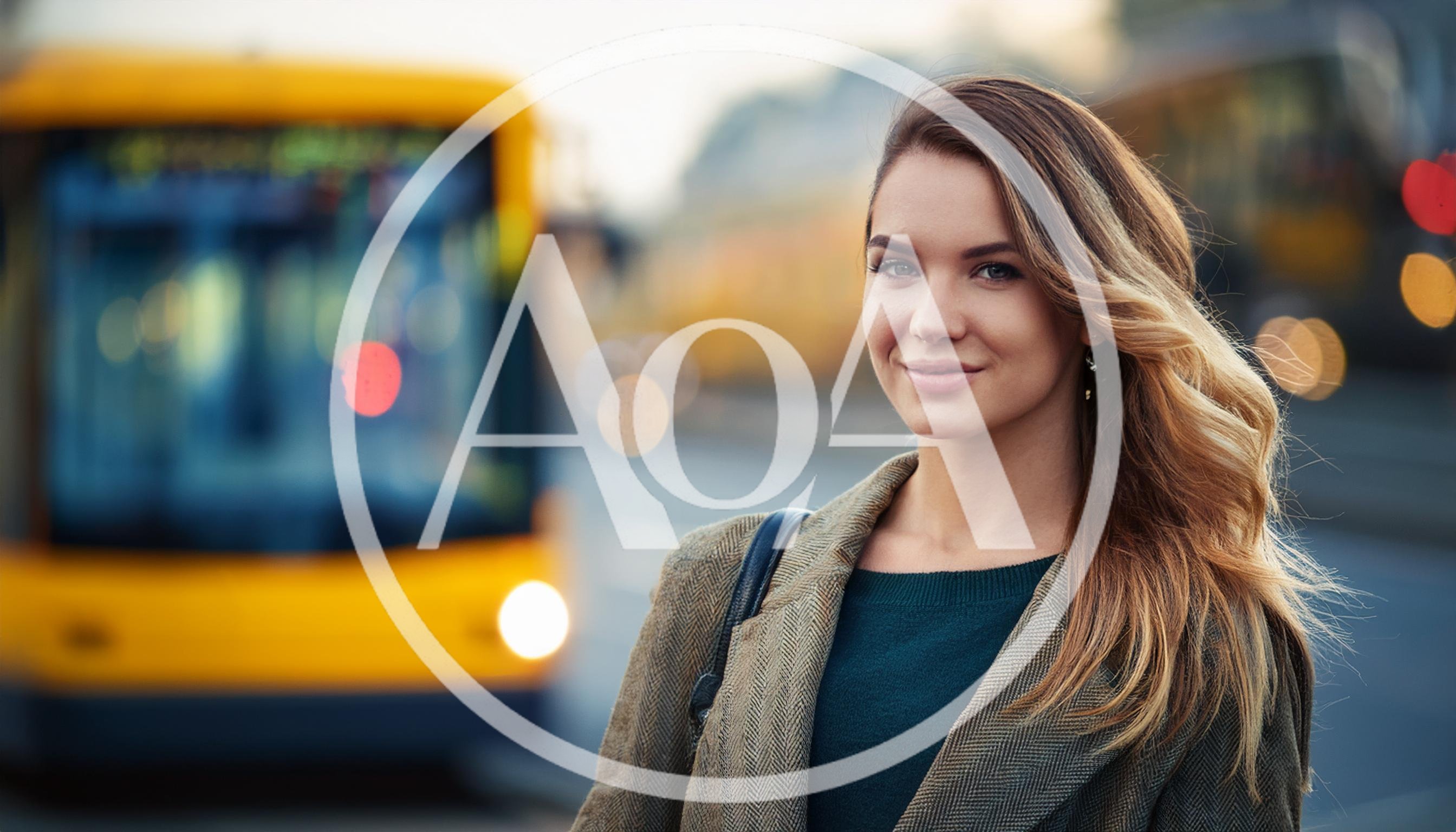 Young Woman Standing At A City Bus Stop