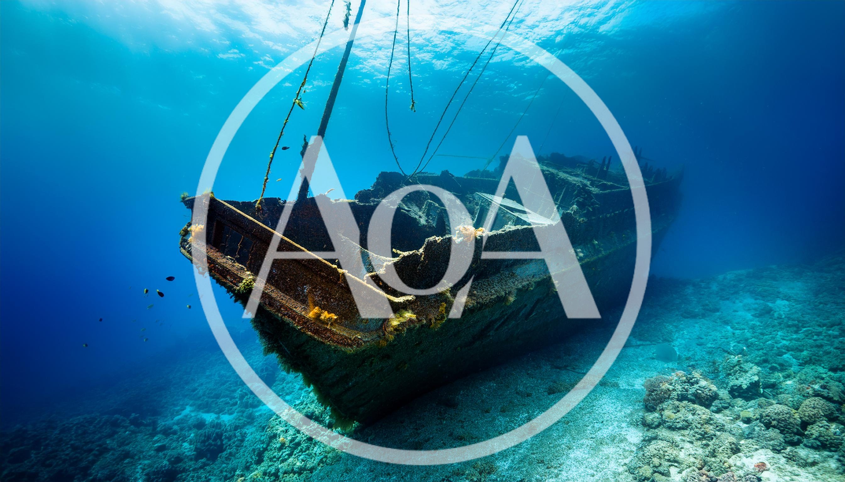 Sunken Shipwreck Resting On The Ocean Floor