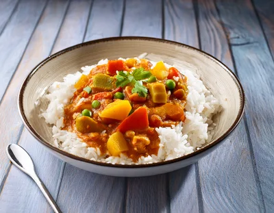 Bowl Of Vegetable Curry With Steamed White Rice
