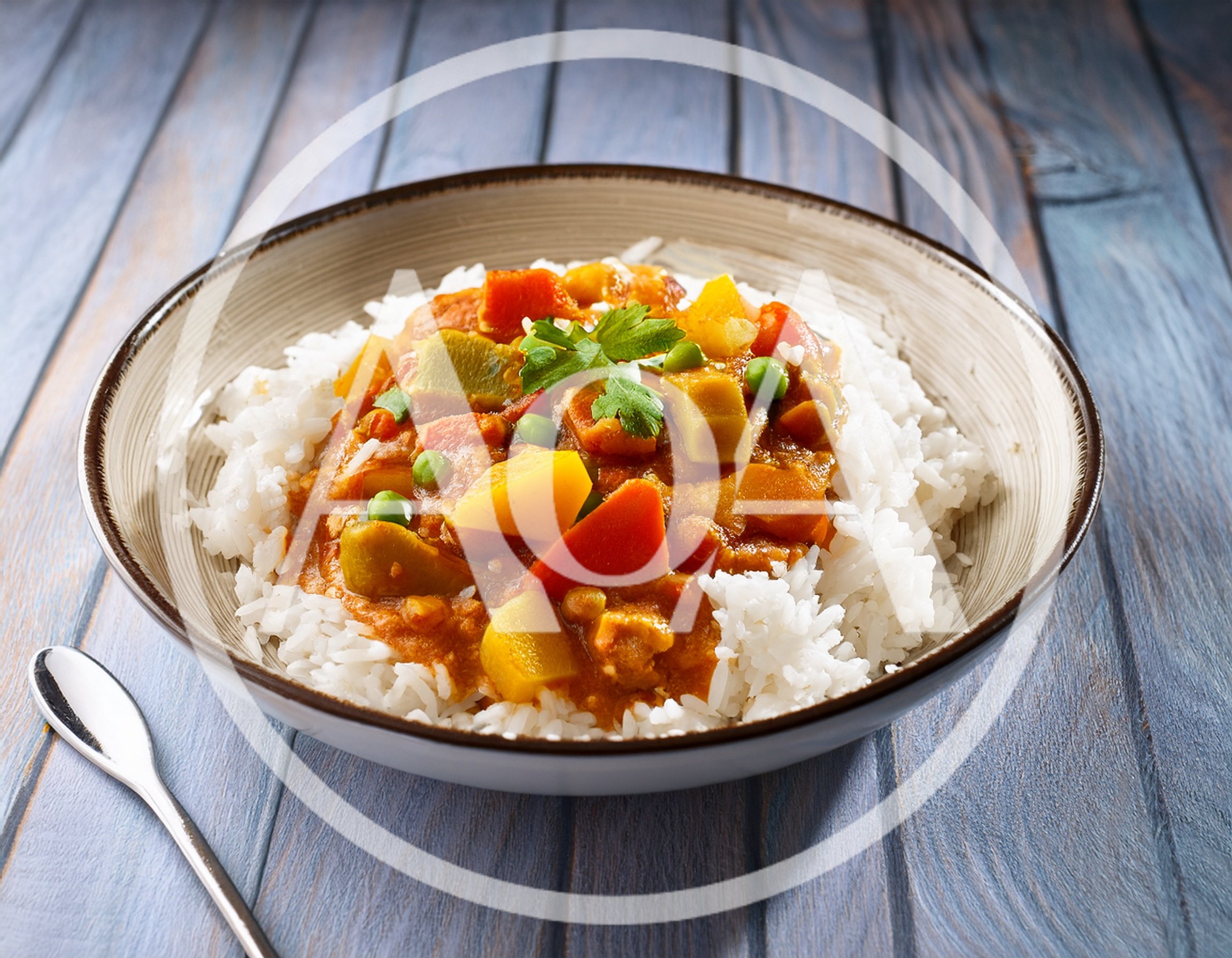 Bowl Of Vegetable Curry With Steamed White Rice